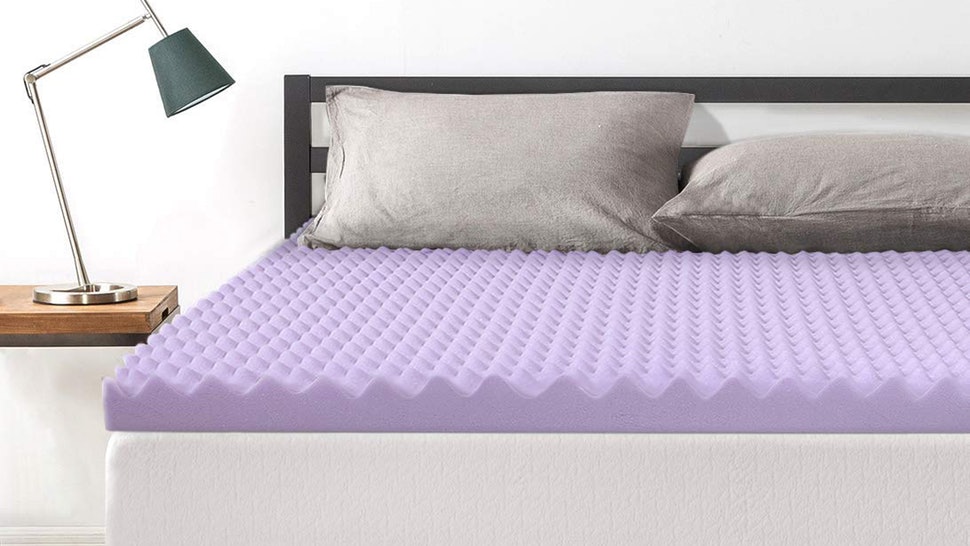 egg carton mattress topper on bed